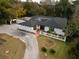 Single-story home with dark roof, white exterior, and a landscaped yard at 409 San Sebastian Prado, Altamonte Springs, FL 32714