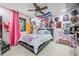 Colorful bedroom with a full-size bed and unique wall decor at 409 San Sebastian Prado, Altamonte Springs, FL 32714