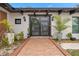 Modern front entrance with double glass doors, brick walkway, and potted plants at 409 San Sebastian Prado, Altamonte Springs, FL 32714