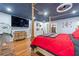 Main bedroom with a four-poster bed, hardwood floors, and built-in shelving at 409 San Sebastian Prado, Altamonte Springs, FL 32714