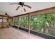 Spacious screened porch with wood ceiling, tile floor, and ceiling fans at 409 San Sebastian Prado, Altamonte Springs, FL 32714