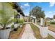 A brick-lined walkway leads to the home's entrance, surrounded by landscaping at 409 San Sebastian Prado, Altamonte Springs, FL 32714