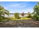 Serene backyard with lake view and lush landscape at 41235 Silver Dr, Umatilla, FL 32784