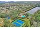 Aerial view of community amenities including pool and tennis courts at 4549 Saddleworth Cir, Orlando, FL 32826