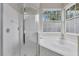 Clean bathroom with shower and bathtub, featuring a large window at 4549 Saddleworth Cir, Orlando, FL 32826