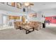 Open living area with leather sofas, a coffee table, and a view of the kitchen at 4549 Saddleworth Cir, Orlando, FL 32826