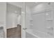 Bathroom featuring a shower and bathtub combination for relaxation at 5571 Creek Haven Way, Lakeland, FL 33810