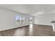 Bright living room featuring wood-look floors, recessed lighting, a window, and sliding glass doors at 5571 Creek Haven Way, Lakeland, FL 33810