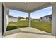 Covered patio overlooking a grassy backyard perfect for outdoor living at 5571 Creek Haven Way, Lakeland, FL 33810