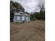 Fixer-upper home with a rustic exterior and needs significant renovations at 620 Cochran Rd, Geneva, FL 32732