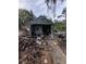 Overgrown and cluttered detached garage needs significant cleanup at 620 Cochran Rd, Geneva, FL 32732