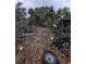 Overgrown lot with debris and tires at 620 Cochran Rd, Geneva, FL 32732