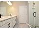 Double vanity bathroom with modern finishes and a separate shower at 627 Bayhawk St, Debary, FL 32713