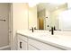 Double vanity bathroom with modern finishes and a large shower at 627 Bayhawk St, Debary, FL 32713