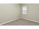 Simple bedroom with carpet and neutral walls at 627 Bayhawk St, Debary, FL 32713