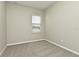 Simple bedroom with carpet, neutral walls, and a window at 627 Bayhawk St, Debary, FL 32713