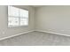 Spacious bedroom with neutral walls and grey carpet at 627 Bayhawk St, Debary, FL 32713