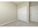 Bedroom with double door closet and neutral walls at 627 Bayhawk St, Debary, FL 32713