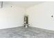 Unfinished garage with concrete floor and water heater at 627 Bayhawk St, Debary, FL 32713