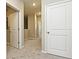 Linen closet and hallway with carpet and neutral walls at 627 Bayhawk St, Debary, FL 32713