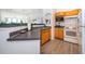 Kitchen features wood cabinets and modern appliances at 6413 Astor Village Ave # 305, Orlando, FL 32835