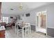 Small dining area with white table and chairs near living room at 680 Avenue N Se, Winter Haven, FL 33880