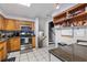 Well-equipped kitchen with wood cabinets and granite countertops at 680 Avenue N Se, Winter Haven, FL 33880