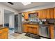 Galley style kitchen with stainless steel appliances at 680 Avenue N Se, Winter Haven, FL 33880