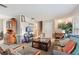 Spacious living room featuring a wood cabinet and TV at 680 Avenue N Se, Winter Haven, FL 33880