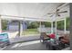 Screened porch overlooking backyard with pool and shed at 680 Avenue N Se, Winter Haven, FL 33880