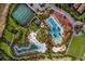 Aerial view of community with pools, tennis courts at 7619 Oakmoss Sw Loop, Davenport, FL 33837