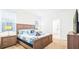 Spacious bedroom with king-size bed and en-suite bathroom at 7619 Oakmoss Sw Loop, Davenport, FL 33837