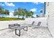 Relaxing backyard patio with seating and modern furniture at 7740 Sandy Ridge Dr # 111, Reunion, FL 34747