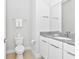 Clean bathroom with modern vanity and gray countertop at 7740 Sandy Ridge Dr # 111, Reunion, FL 34747