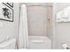 Bathroom with shower/tub combo and white tile at 7740 Sandy Ridge Dr # 111, Reunion, FL 34747