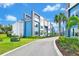 Private residential community with townhomes and palm trees at 7740 Sandy Ridge Dr # 111, Reunion, FL 34747