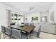 Dining area with a table and six chairs next to the kitchen at 7740 Sandy Ridge Dr # 111, Reunion, FL 34747