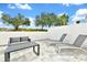 Relaxing patio with lounge chairs and seating at 7740 Sandy Ridge Dr # 111, Reunion, FL 34747