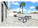 Private patio with dining table and seating area at 7740 Sandy Ridge Dr # 111, Reunion, FL 34747