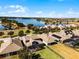 Aerial view of houses near lake, showcasing community at 8547 Bayview Crossing Dr, Winter Garden, FL 34787