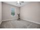 Small bedroom with carpeted floors and a stationary bike at 8547 Bayview Crossing Dr, Winter Garden, FL 34787