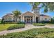 Community clubhouse with stone accents and landscaping at 8547 Bayview Crossing Dr, Winter Garden, FL 34787