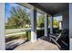 Relaxing front porch with two adirondack chairs and view of the neighborhood at 8547 Bayview Crossing Dr, Winter Garden, FL 34787