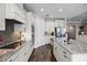 Modern kitchen with an island, stainless steel appliances and hardwood floors at 8547 Bayview Crossing Dr, Winter Garden, FL 34787