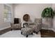 Sitting area featuring two patterned armchairs, ottoman, and a large window at 8547 Bayview Crossing Dr, Winter Garden, FL 34787