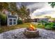 Landscaped backyard with fire pit and storage shed at 1012 N Ferncreek Ave, Orlando, FL 32803