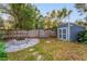 Backyard with fire pit and storage shed at 1012 N Ferncreek Ave, Orlando, FL 32803