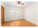 Bright bedroom with wood floors, ceiling fan, and ample natural light at 1012 N Ferncreek Ave, Orlando, FL 32803