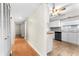 Light and airy hallway with wood flooring and access to other rooms at 1012 N Ferncreek Ave, Orlando, FL 32803