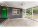 Covered screened porch with concrete flooring and ceiling fan at 1012 N Ferncreek Ave, Orlando, FL 32803